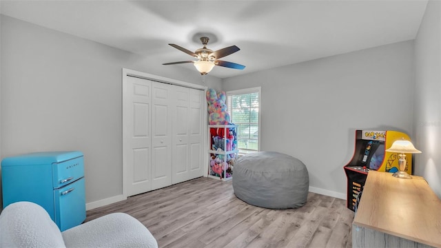 4825 Foxrun, Lakeland, FL 33813 - sitting room with wood finished floors, ceiling fan, and baseboards