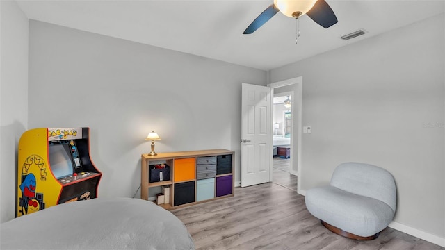 4825 Foxrun, Lakeland, FL 33813 - bedroom with light wood-style flooring, baseboards, and ceiling fan