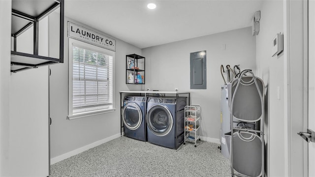 4825 Foxrun, Lakeland, FL 33813 - laundry room featuring washer and dryer, electric panel, and baseboards
