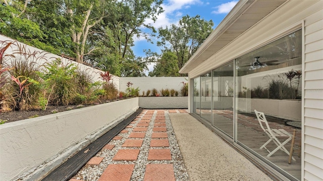 4825 Foxrun, Lakeland, FL 33813 - fenced backyard featuring a sunroom