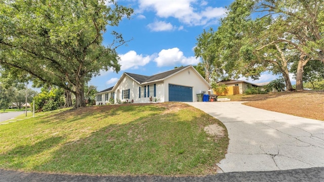 4825 Foxrun, Lakeland, FL 33813 - ranch-style house featuring a garage, driveway, and a front lawn