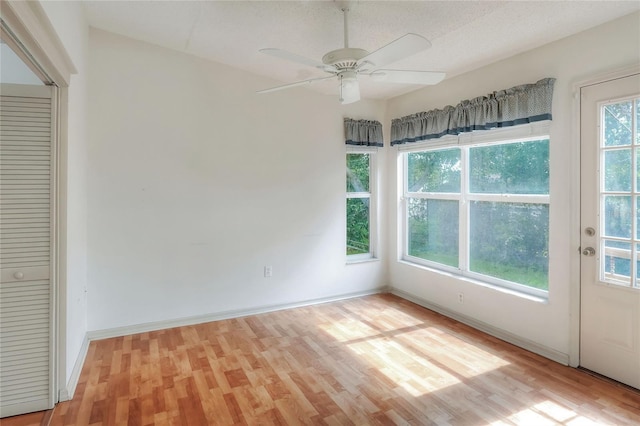 6065 Magpie Dr, Lakeland, FL 33809 - spare room featuring light wood finished floors, a ceiling fan, and baseboards