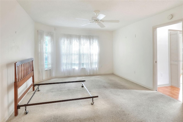 6065 Magpie Dr, Lakeland, FL 33809 - unfurnished bedroom with carpet, ceiling fan, and baseboards