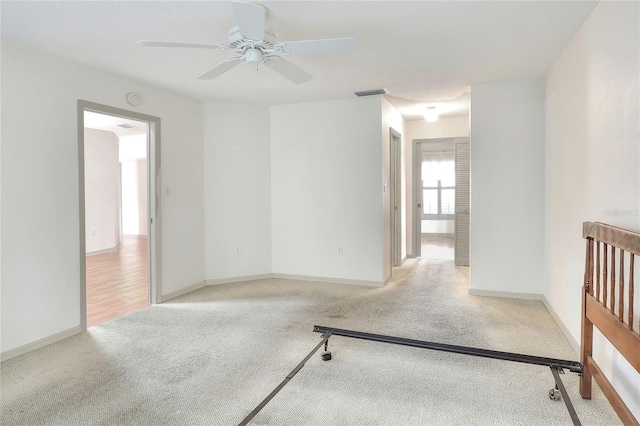 6065 Magpie Dr, Lakeland, FL 33809 - spare room with carpet, ceiling fan, and baseboards