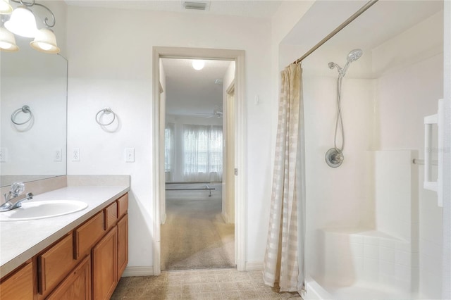 6065 Magpie Dr, Lakeland, FL 33809 - full bath featuring a shower with curtain, vanity, and baseboards