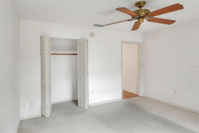 6065 Magpie Dr, Lakeland, FL 33809 - unfurnished bedroom with carpet flooring, a closet, baseboards, and ceiling fan