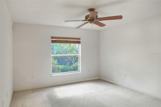 6065 Magpie Dr, Lakeland, FL 33809 - carpeted spare room with ceiling fan, baseboards, and a textured ceiling