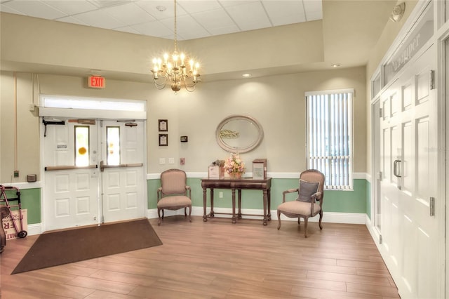 6065 Magpie Dr, Lakeland, FL 33809 - entrance foyer with wood finished floors, a chandelier, healthy amount of natural light, baseboards, and recessed lighting