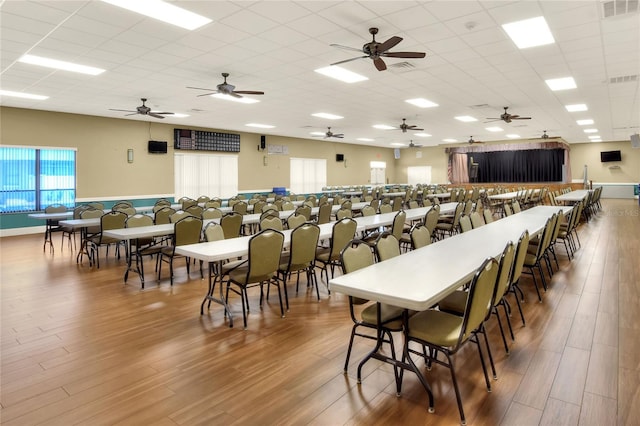6065 Magpie Dr, Lakeland, FL 33809 - dining area featuring wood finished floors, a drop ceiling, and ceiling fan
