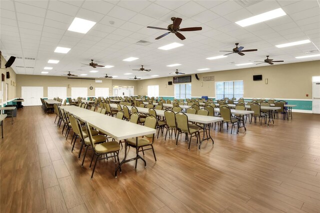 6065 Magpie Dr, Lakeland, FL 33809 - dining room with wood finished floors, a paneled ceiling, and a ceiling fan