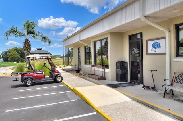 6065 Magpie Dr, Lakeland, FL 33809 - entrance to property with stucco siding and uncovered parking