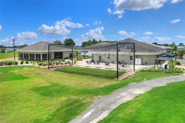 6065 Magpie Dr, Lakeland, FL 33809 - rear view of house featuring a patio, a gazebo, and a lawn