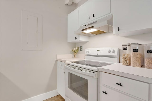 321 Birch Way Unit 321, Haines City, FL 33844 - kitchen featuring electric range, under cabinet range hood, light countertops, and white cabinets