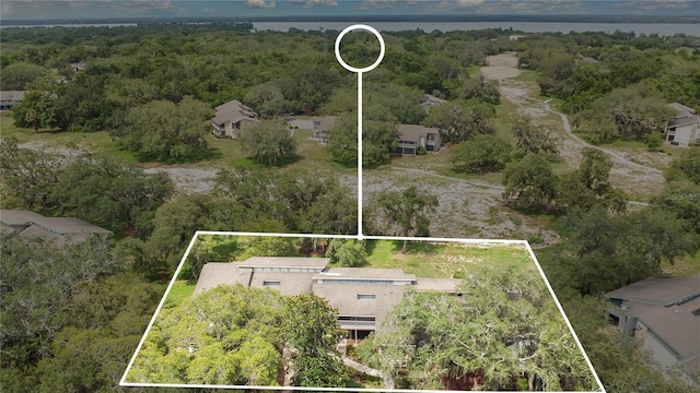 321 Birch Way Unit 321, Haines City, FL 33844 - aerial perspective of suburban area featuring property parcel outlined and a forest