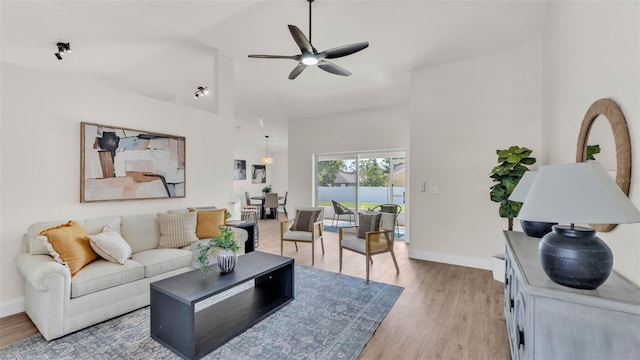 5458 Oakford Dr, Lakeland, FL 33812 - living area with a ceiling fan, baseboards, light wood finished floors, and high vaulted ceiling