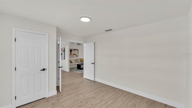5458 Oakford Dr, Lakeland, FL 33812 - empty room featuring baseboards and light wood-type flooring