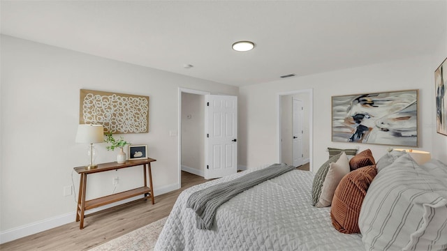 5458 Oakford Dr, Lakeland, FL 33812 - bedroom featuring light wood-style flooring and baseboards