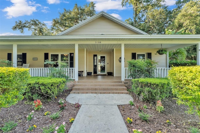 5108 Waterwood Dr, Bartow, FL 33830 - view of exterior entry featuring a porch