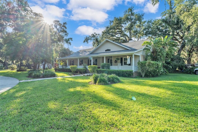 5108 Waterwood Dr, Bartow, FL 33830 - view of front of home featuring covered porch and a front lawn