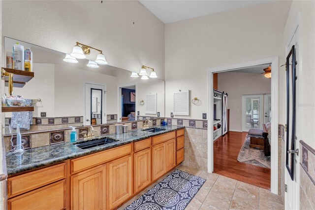 5108 Waterwood Dr, Bartow, FL 33830 - ensuite bathroom with vanity, tile walls, tile patterned floors, and french doors