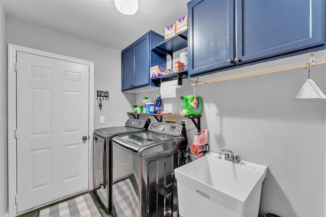 5108 Waterwood Dr, Bartow, FL 33830 - washroom with washing machine and dryer, cabinet space, and a textured ceiling