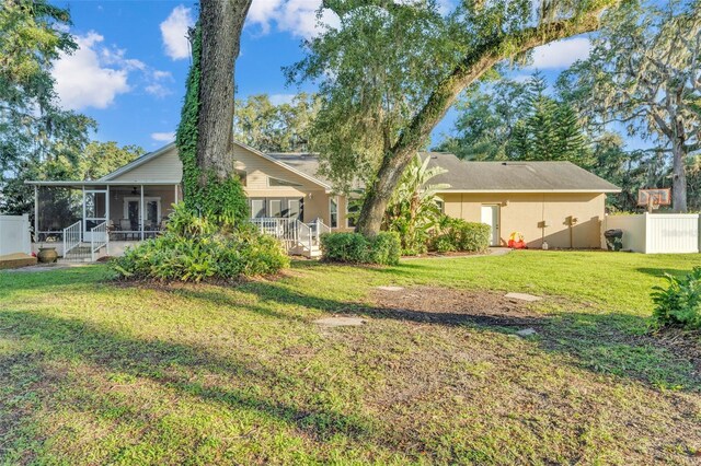 5108 Waterwood Dr, Bartow, FL 33830 - back of house featuring a sunroom