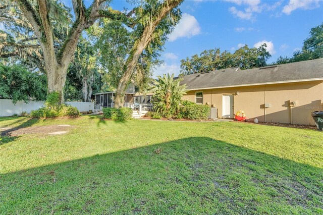 5108 Waterwood Dr, Bartow, FL 33830 - view of yard featuring a sunroom