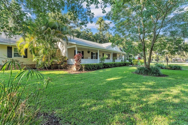 5108 Waterwood Dr, Bartow, FL 33830 - view of front facade with covered porch and a front lawn