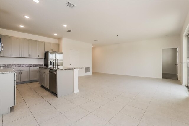 606 Fairview Ave Unit 244, Haines City, FL 33844 - kitchen featuring appliances with stainless steel finishes, recessed lighting, a kitchen island with sink, gray cabinetry, and open floor plan