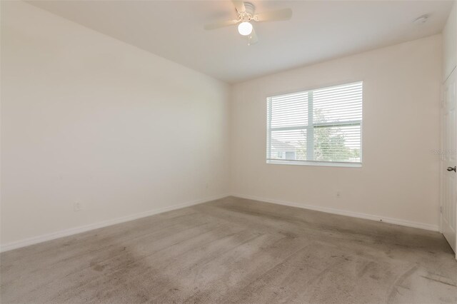 606 Fairview Ave Unit 244, Haines City, FL 33844 - spare room featuring baseboards, ceiling fan, and light carpet