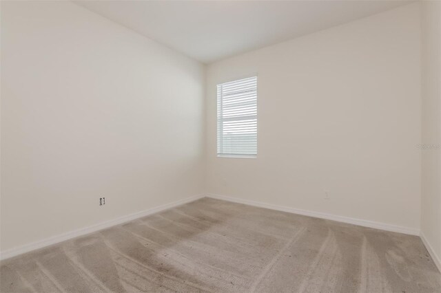 606 Fairview Ave Unit 244, Haines City, FL 33844 - spare room featuring light colored carpet and baseboards