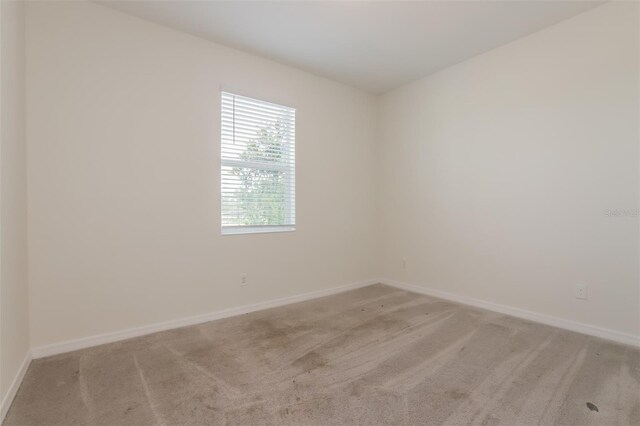 606 Fairview Ave Unit 244, Haines City, FL 33844 - empty room featuring light colored carpet and baseboards