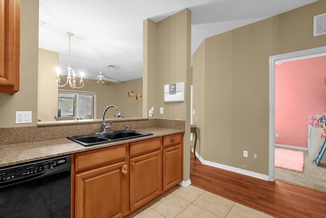 2061 Crestdale Ln Unit 60, Lake Mary, FL 32746 - kitchen with black dishwasher, a sink, a chandelier, brown cabinets, and light wood-style flooring