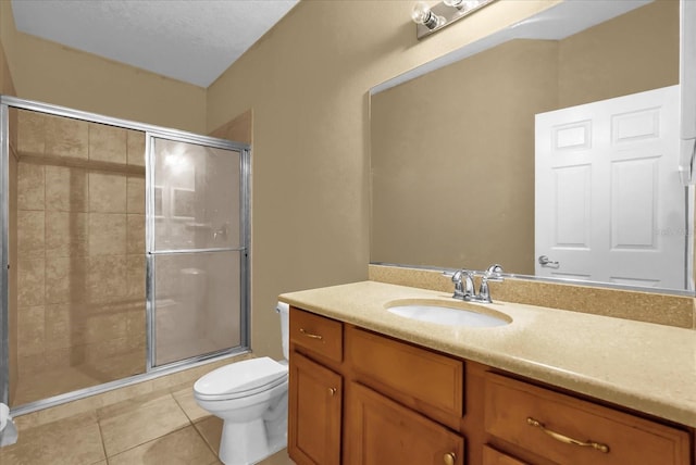 2061 Crestdale Ln Unit 60, Lake Mary, FL 32746 - bathroom with toilet, vanity, a shower stall, and tile patterned flooring