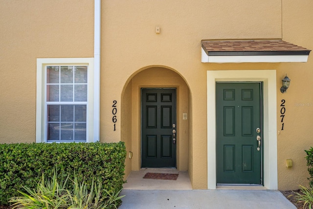 2061 Crestdale Ln Unit 60, Lake Mary, FL 32746 - doorway to property featuring stucco siding