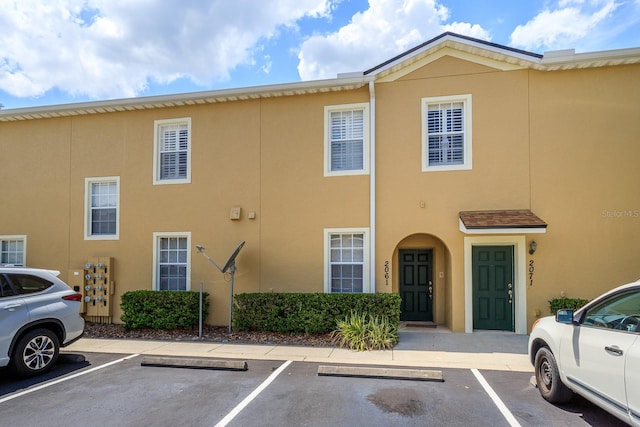 2061 Crestdale Ln Unit 60, Lake Mary, FL 32746 - view of front of house with stucco siding and uncovered parking
