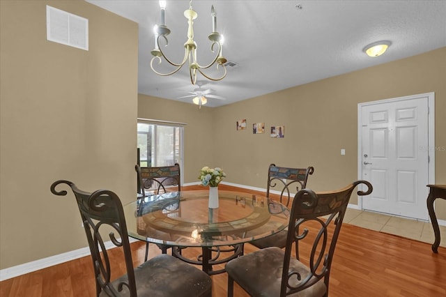 2061 Crestdale Ln Unit 60, Lake Mary, FL 32746 - dining space with baseboards, ceiling fan, light wood-type flooring, and a chandelier