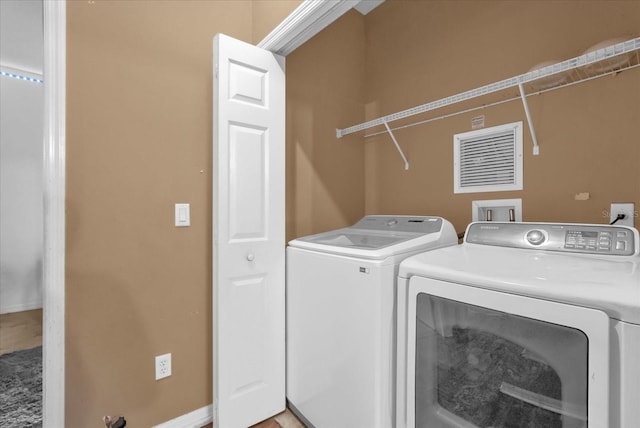 2061 Crestdale Ln Unit 60, Lake Mary, FL 32746 - washroom with washing machine and clothes dryer and baseboards