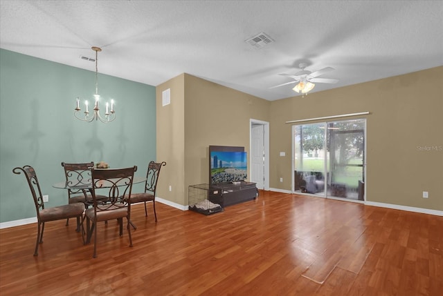 2061 Crestdale Ln Unit 60, Lake Mary, FL 32746 - dining area featuring wood finished floors, a chandelier, baseboards, and a textured ceiling