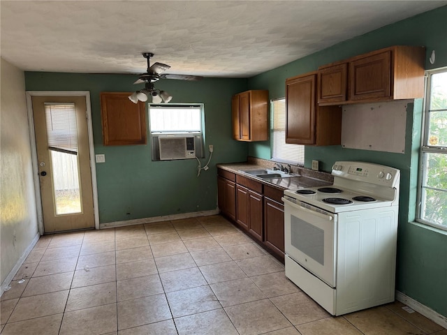 3651 Rifle Range Rd, Winter Haven, FL 33880 - kitchen featuring electric range, a sink, healthy amount of natural light, and a textured ceiling