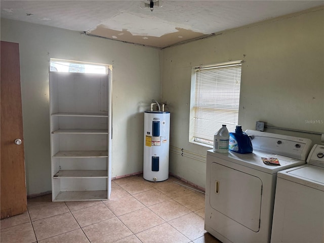3651 Rifle Range Rd, Winter Haven, FL 33880 - laundry area featuring water heater, independent washer and dryer, and light tile patterned floors