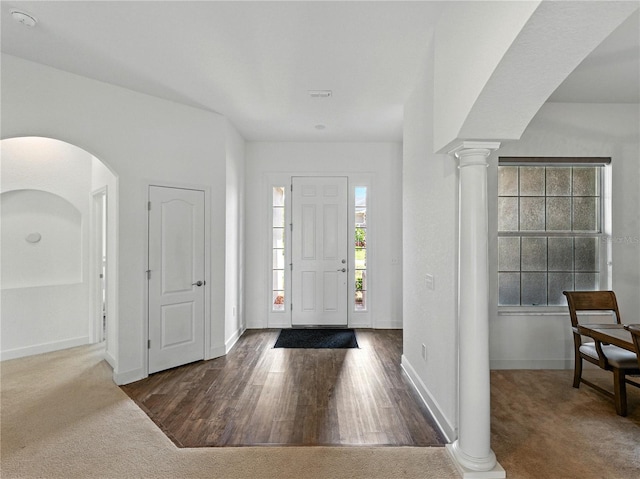 1547 Cordgrass Way, Lakeland, FL 33813 - carpeted foyer with arched walkways, decorative columns, and baseboards