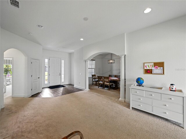 1547 Cordgrass Way, Lakeland, FL 33813 - carpeted entryway with arched walkways, recessed lighting, baseboards, and ornate columns