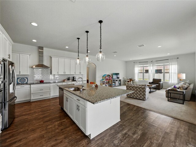 1547 Cordgrass Way, Lakeland, FL 33813 - kitchen with wall chimney exhaust hood, open floor plan, a sink, stainless steel appliances, and recessed lighting