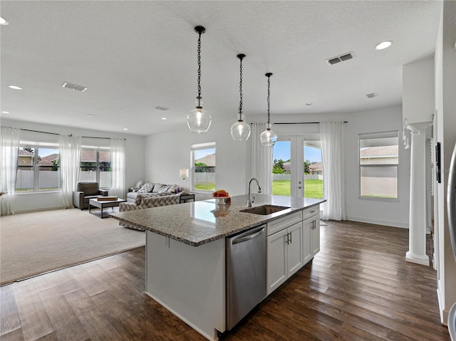 1547 Cordgrass Way, Lakeland, FL 33813 - kitchen with dishwasher, a sink, healthy amount of natural light, light stone countertops, and recessed lighting