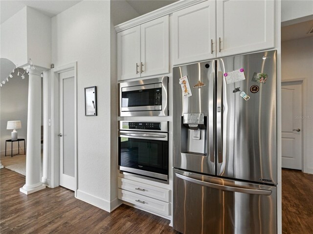 1547 Cordgrass Way, Lakeland, FL 33813 - kitchen featuring stainless steel appliances, dark wood-style floors, baseboards, and white cabinetry