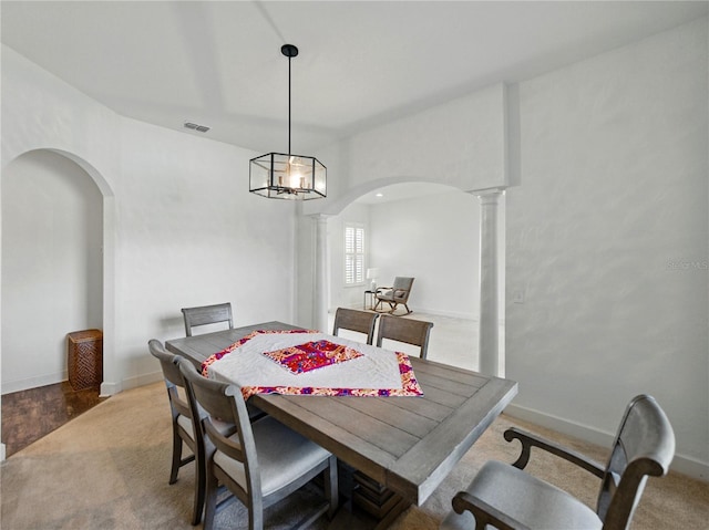 1547 Cordgrass Way, Lakeland, FL 33813 - dining area with arched walkways, ornate columns, carpet, and baseboards
