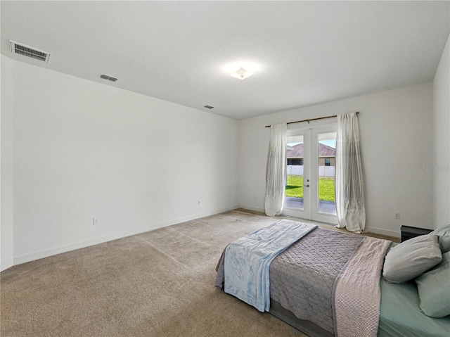 1547 Cordgrass Way, Lakeland, FL 33813 - carpeted bedroom featuring access to exterior, french doors, and baseboards