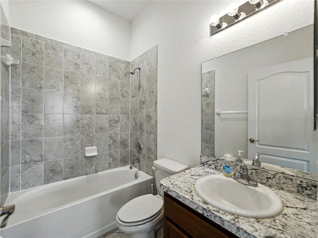 1547 Cordgrass Way, Lakeland, FL 33813 - bathroom featuring toilet, bathtub / shower combination, vanity, and a textured wall