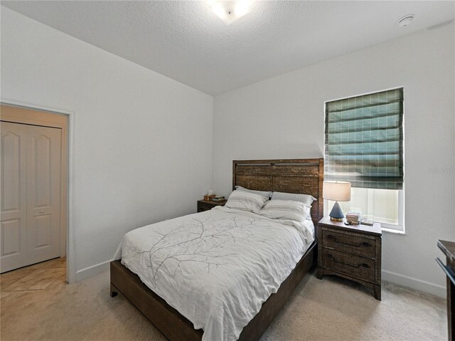 1547 Cordgrass Way, Lakeland, FL 33813 - bedroom with light carpet and baseboards